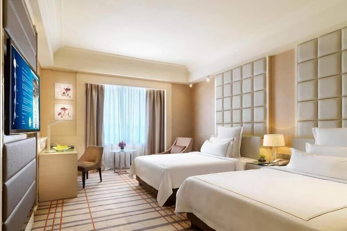 Premium bedding, down comforters, free minibar items, in-room safe