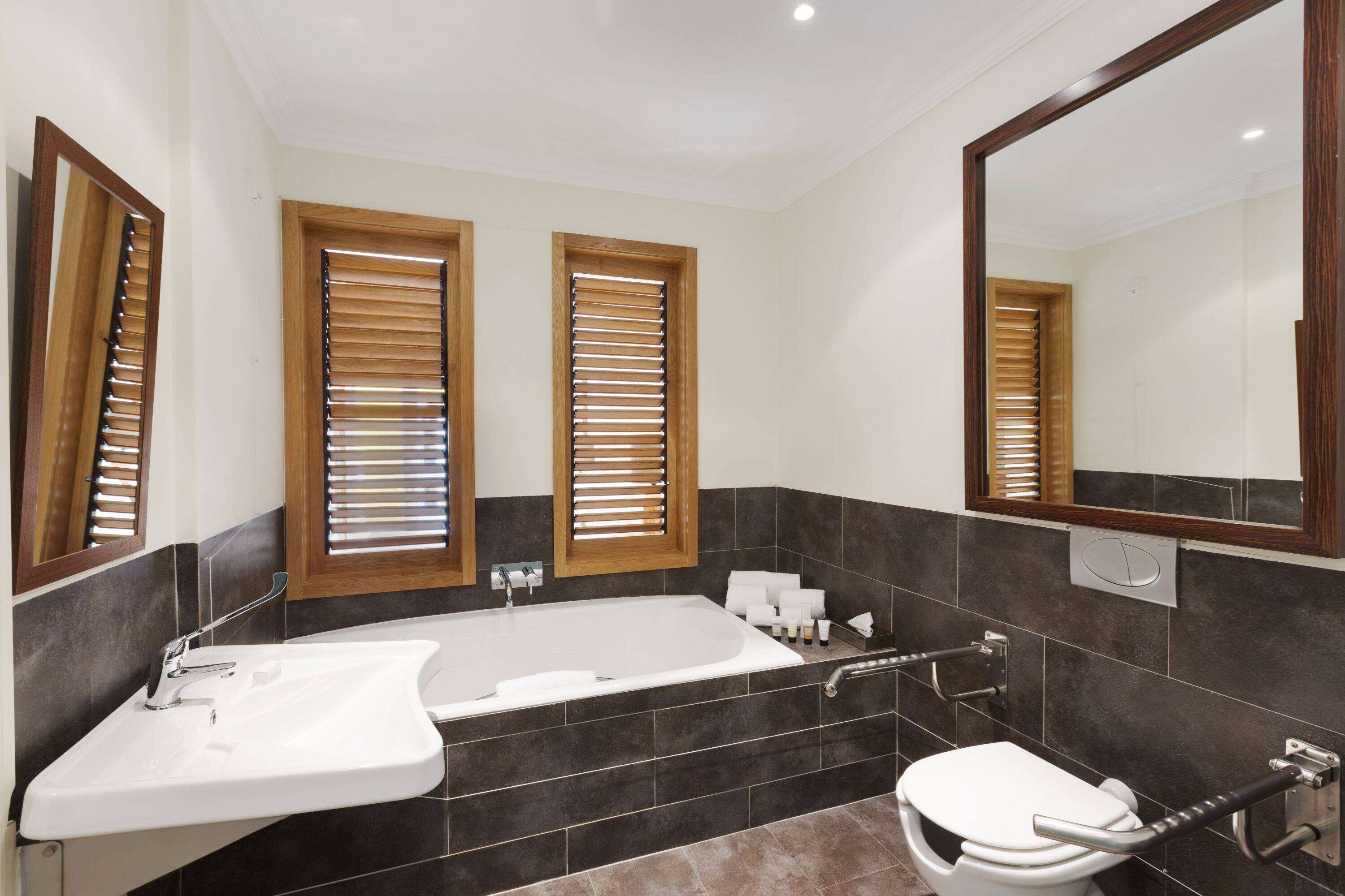 suite, 1 king bed, golf view (duplex) | bathroom | separate bathtub and shower, rainfall showerhead, hair dryer, bidet