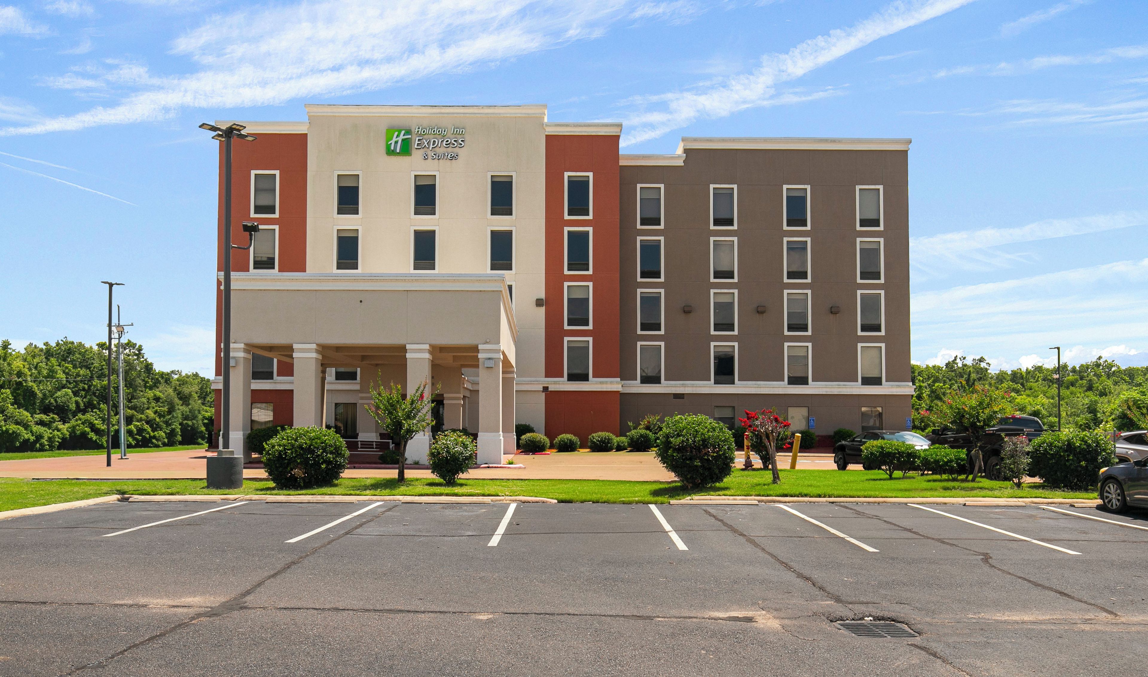 A Holiday Inn Express hotel with a parking lot in front.
