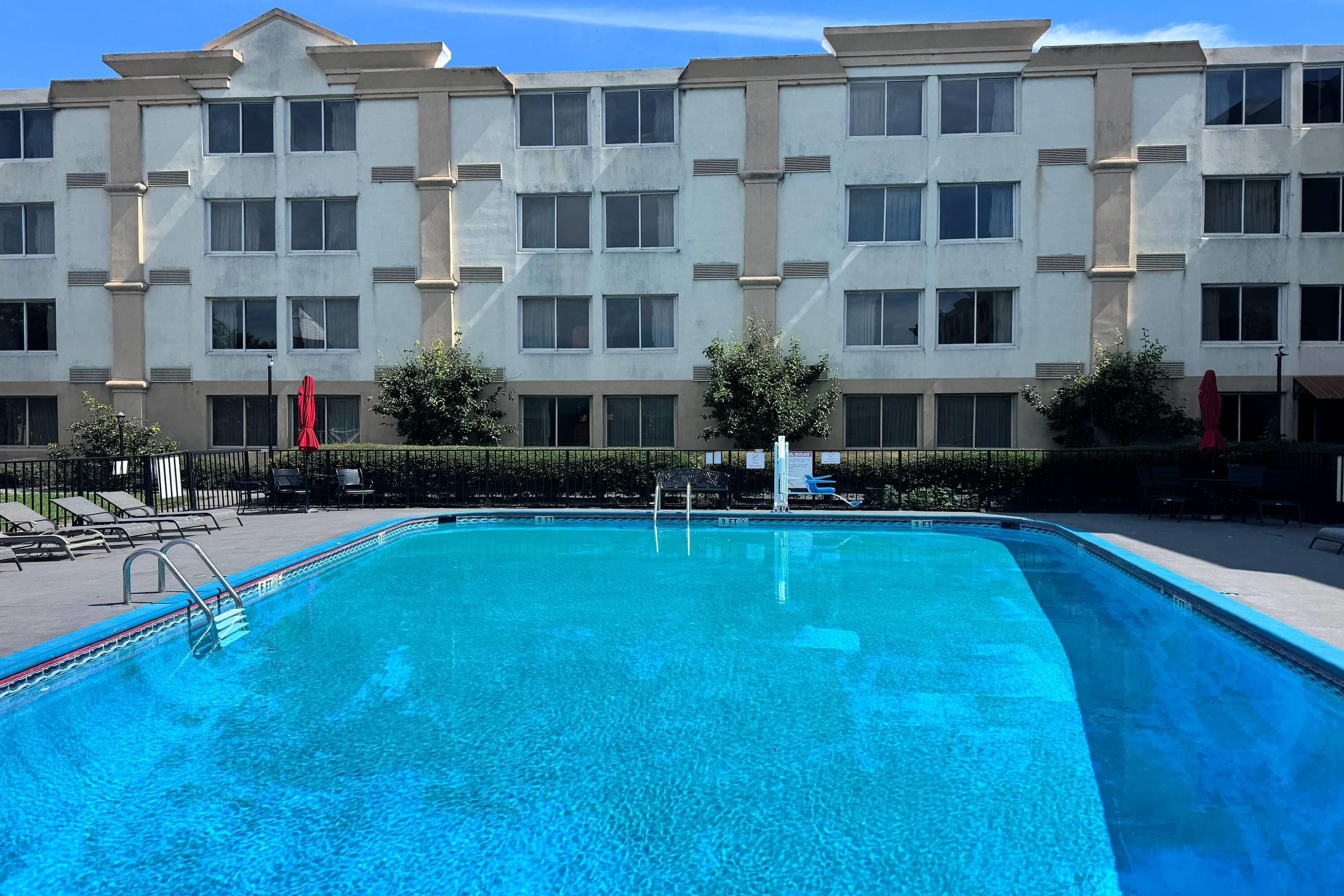 Seasonal outdoor pool, open 8:00 AM to 8:00 PM, pool loungers