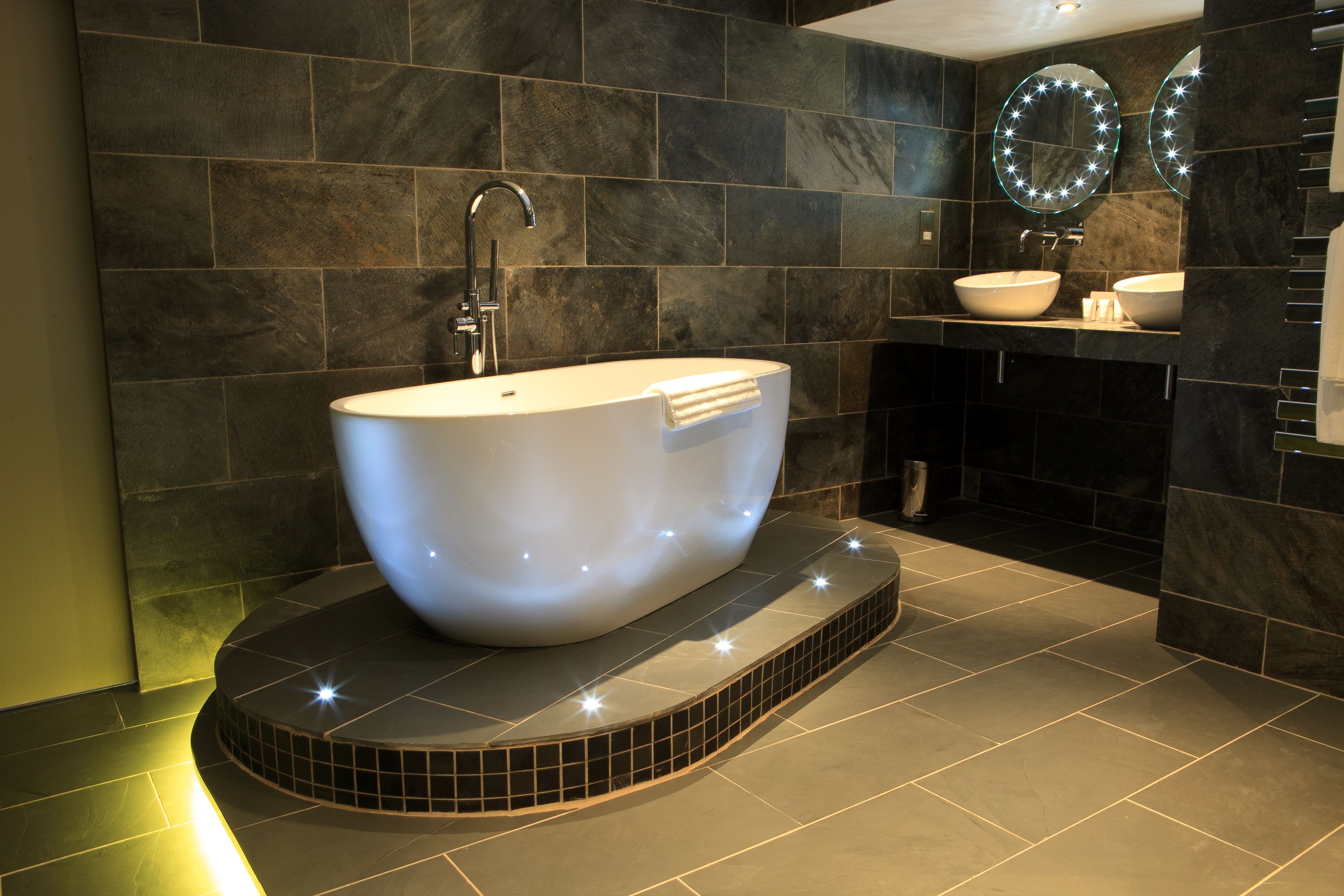 suite, 1 king bed, non smoking (living room) | bathroom | combined shower/bathtub, free toiletries, hair dryer, slippers