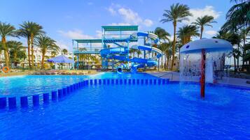 Relax by the pool surrounded by palm trees and enjoy the water slides.