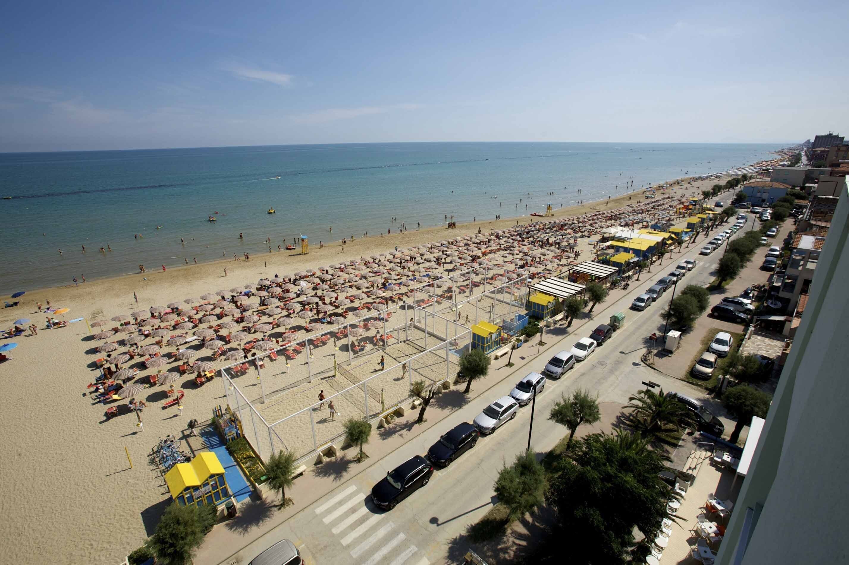 On the beach, sun loungers, beach umbrellas