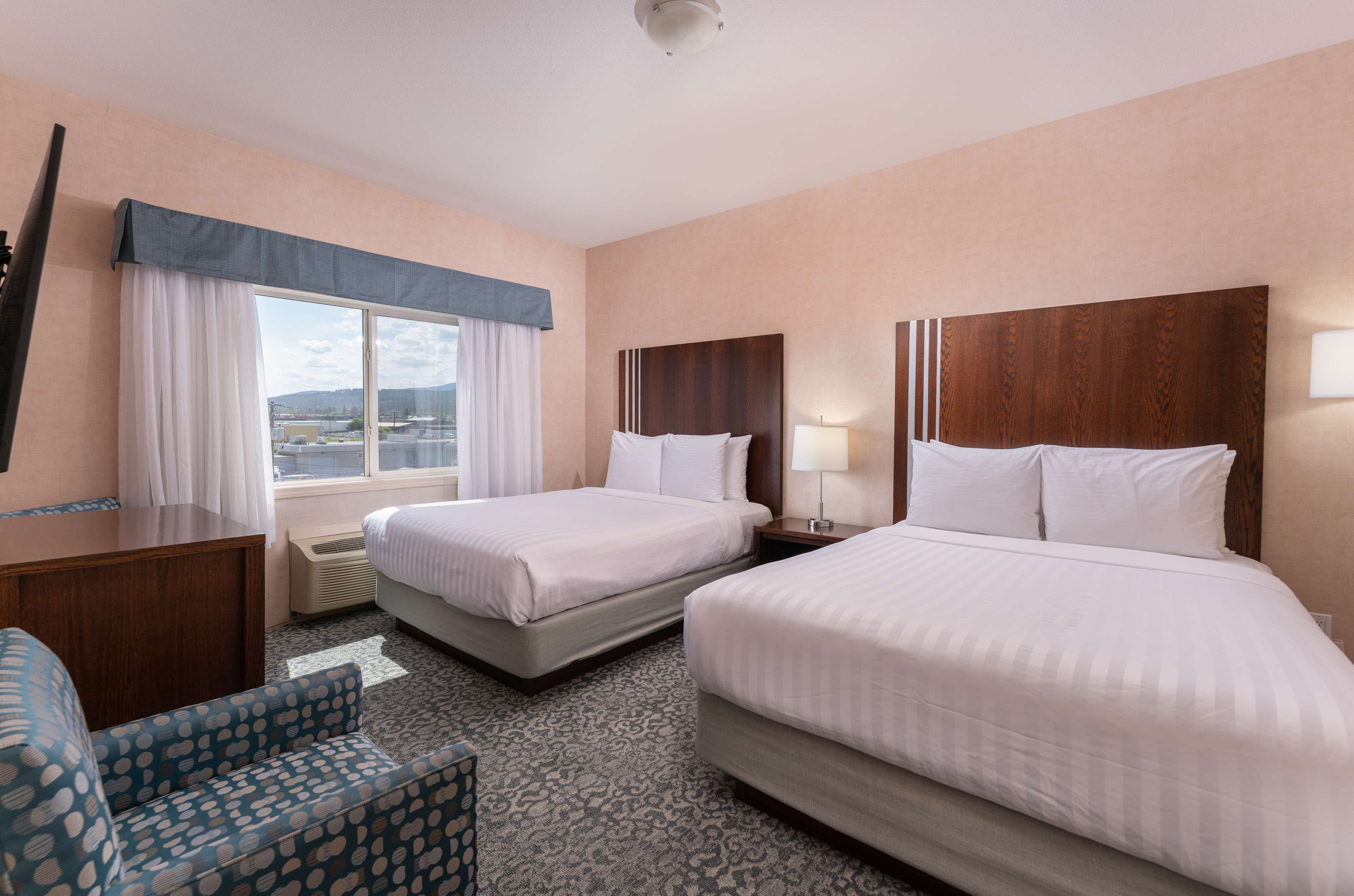 suite, 2 queen beds, non smoking, kitchenette (separate living room) | 1 bedroom, desk, iron/ironing board, cots/infant beds