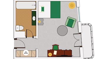Un plan d’aménagement de chambre d’hôtel comprenant un lit, un bureau, une chaise, une armoire, une salle de bain et un petit coin salon.