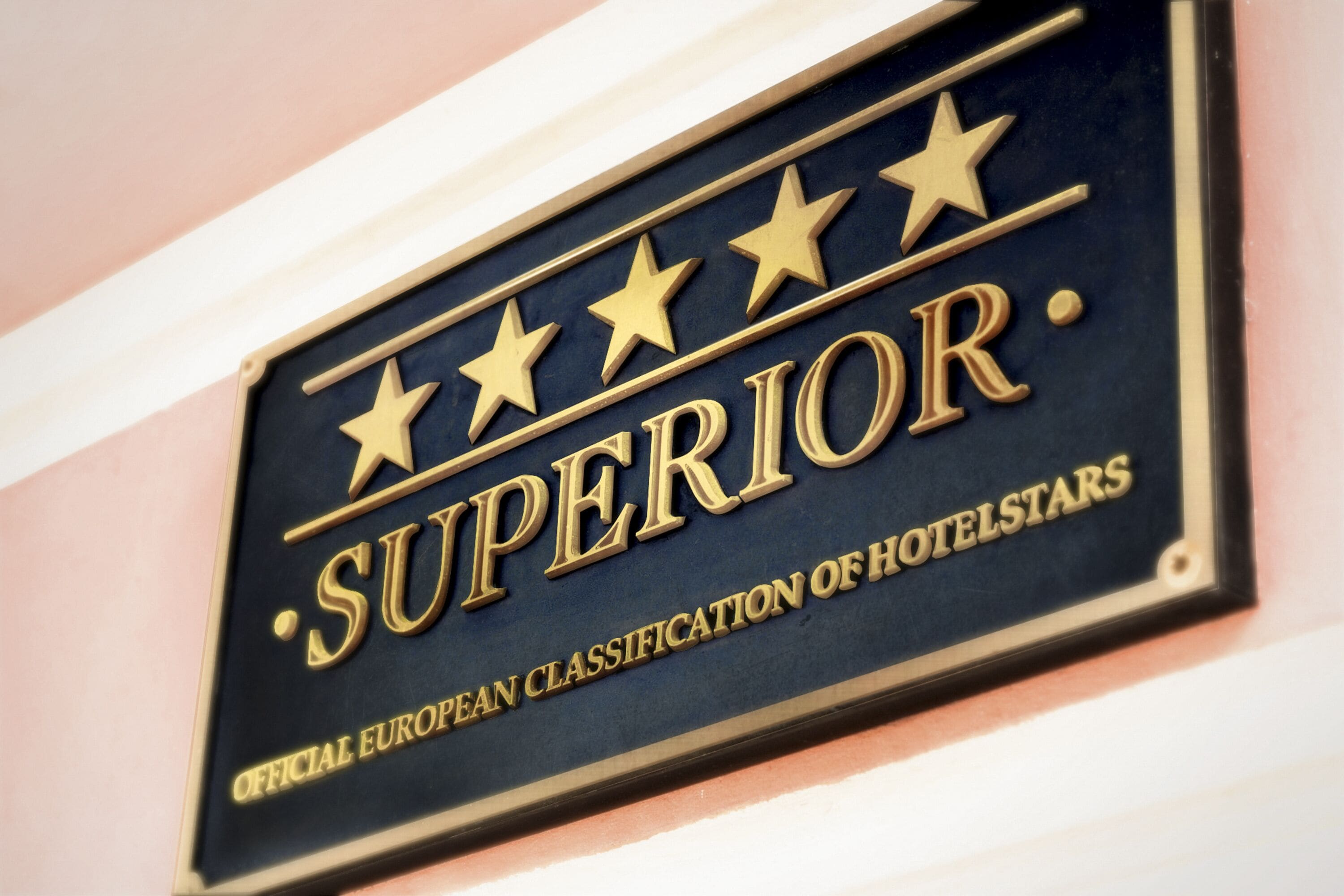 A sign with the text 'SUPERIOR' and 'OFFICIAL EUROPEAN CLASSIFICATION OF HOTELSTARS'.