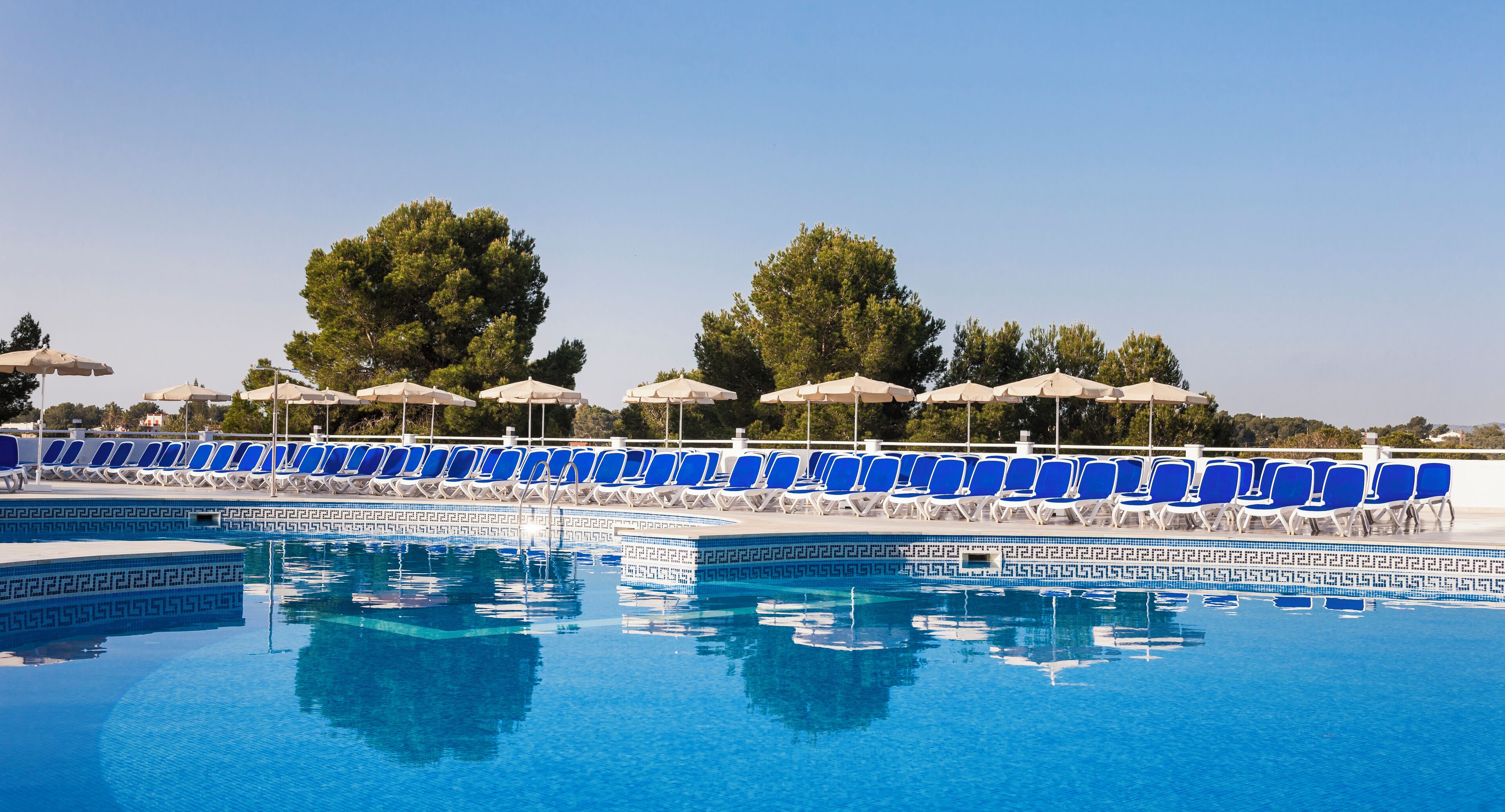 outdoor pool, pool umbrellas, pool loungers