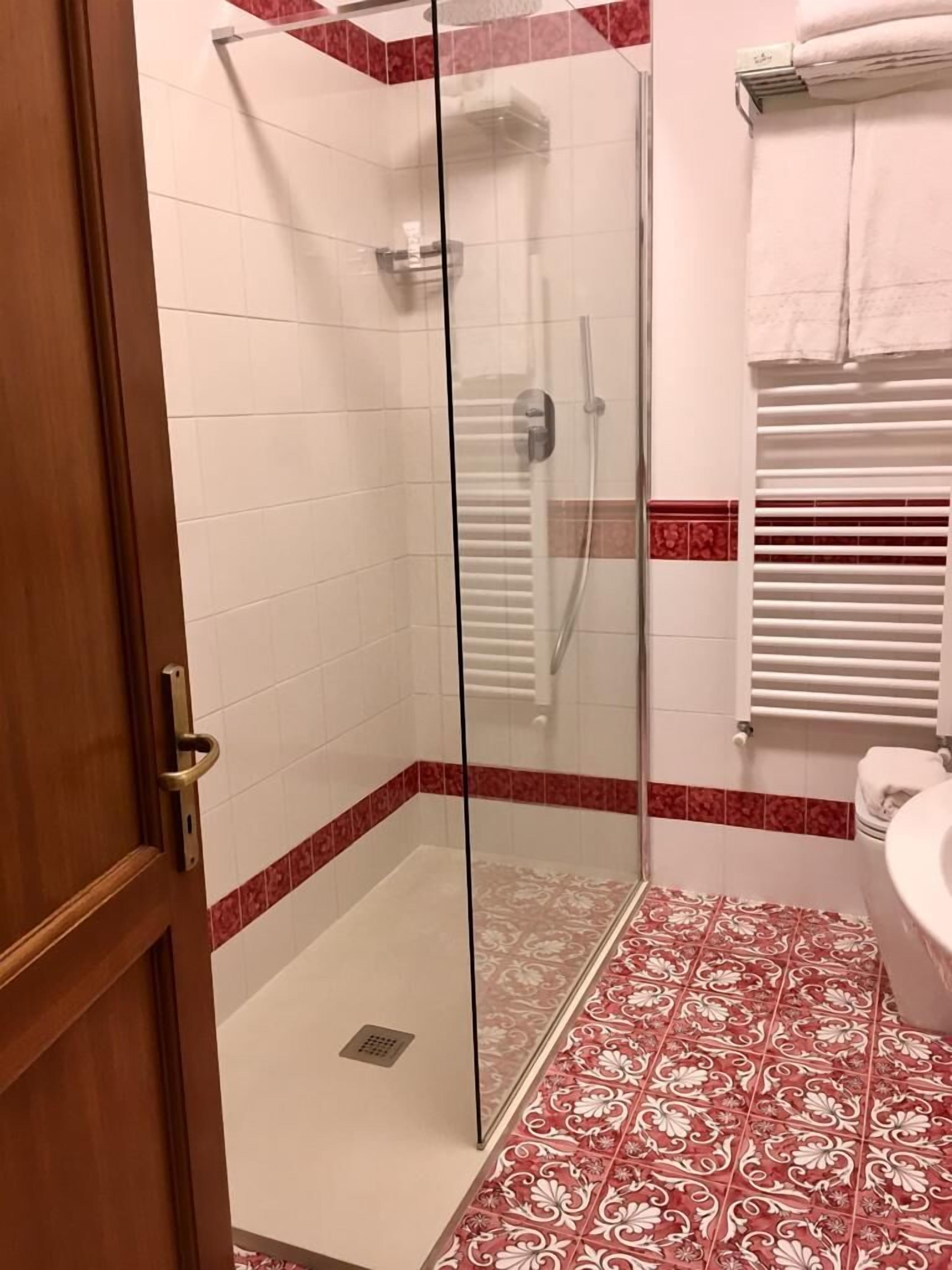 superior double room | bathroom | shower, rainfall showerhead, free toiletries, hair dryer