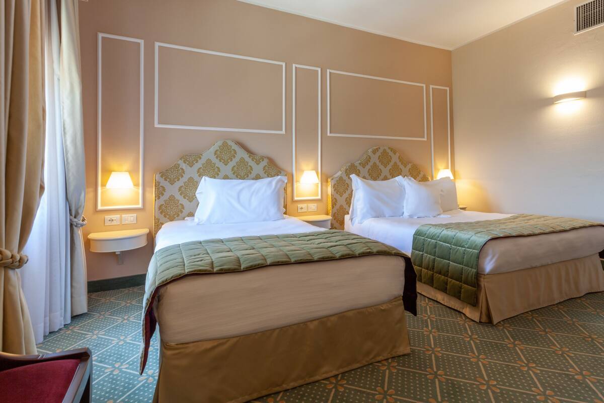 family room | 1 bedroom, premium bedding, minibar, in-room safe
