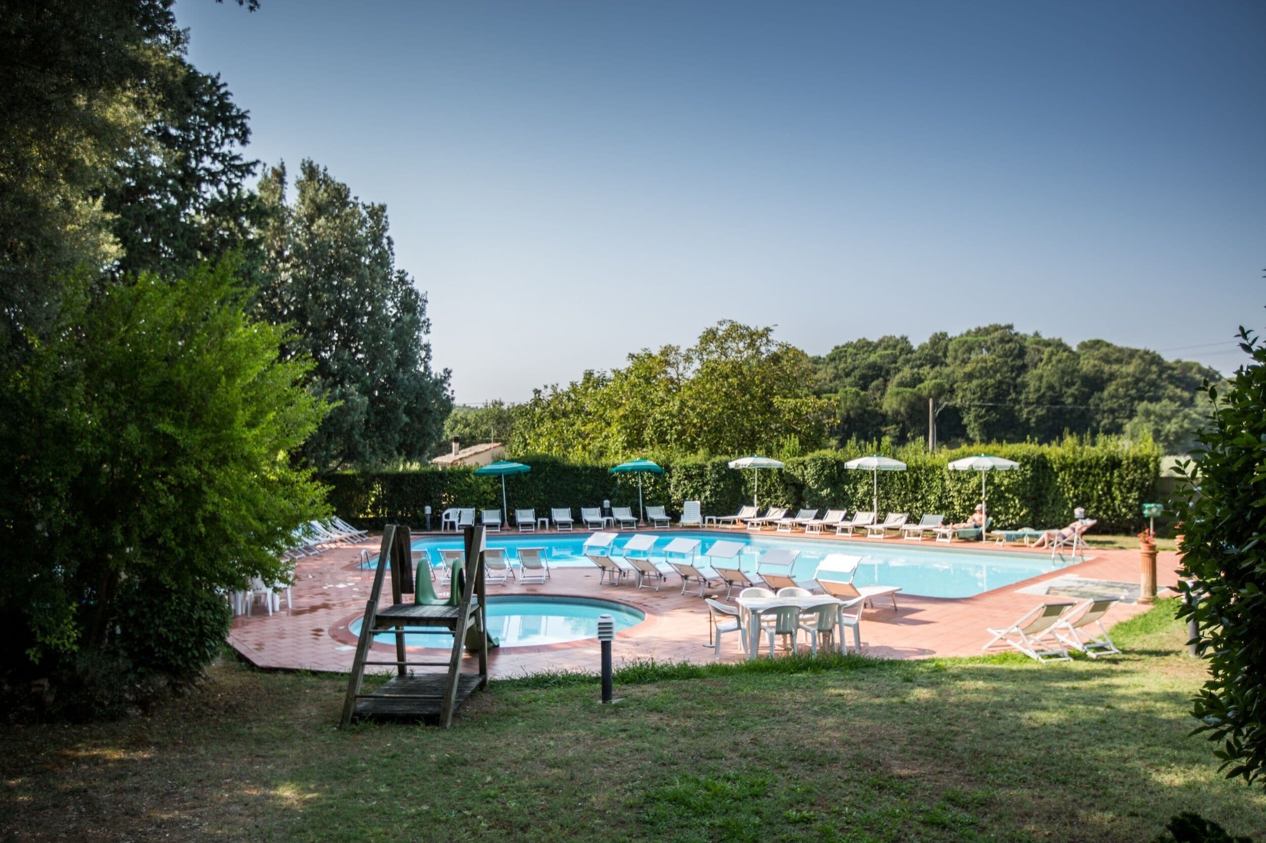 seasonal outdoor pool, open 7 am to 8:30 pm, pool umbrellas