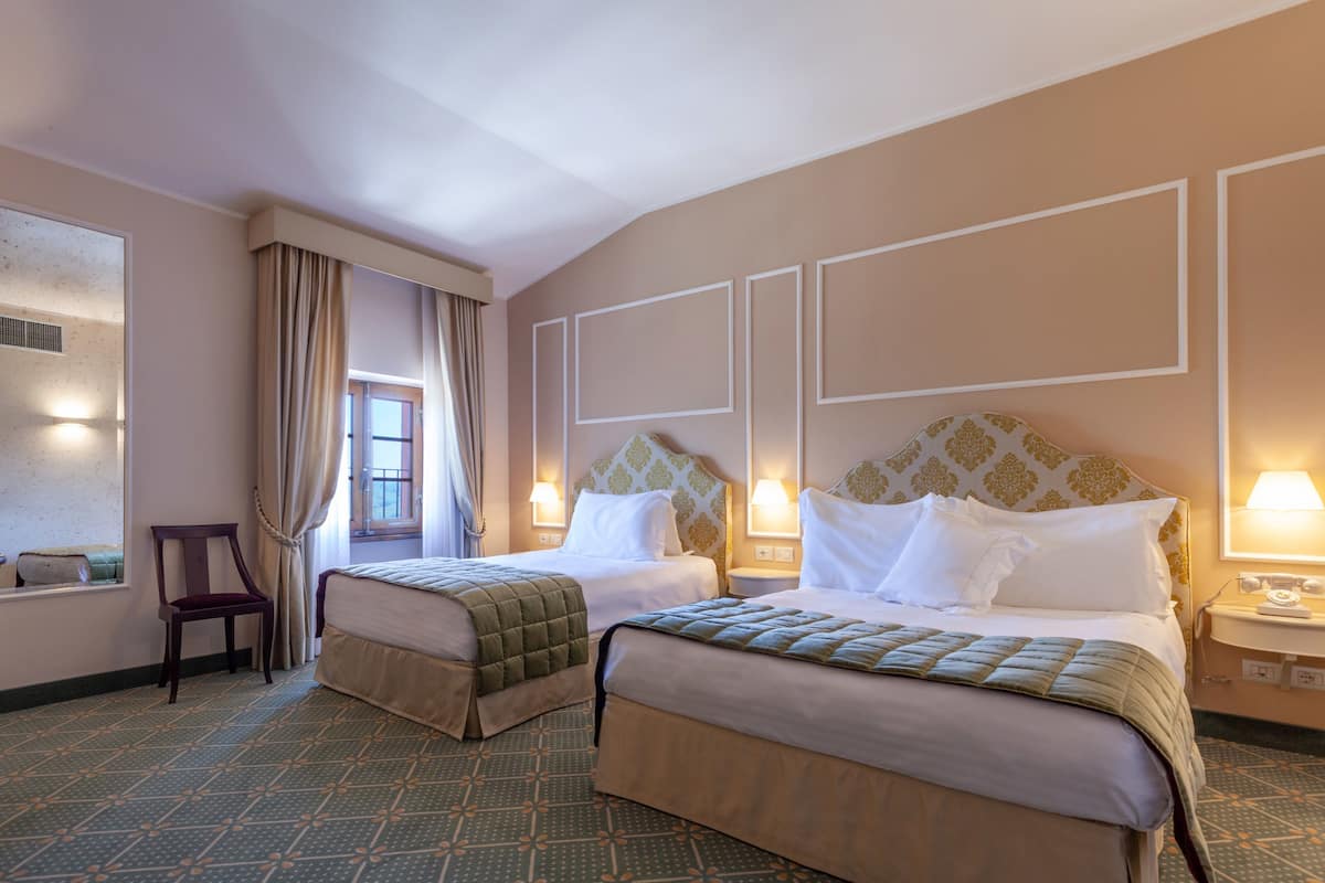 family room | 1 bedroom, premium bedding, minibar, in-room safe