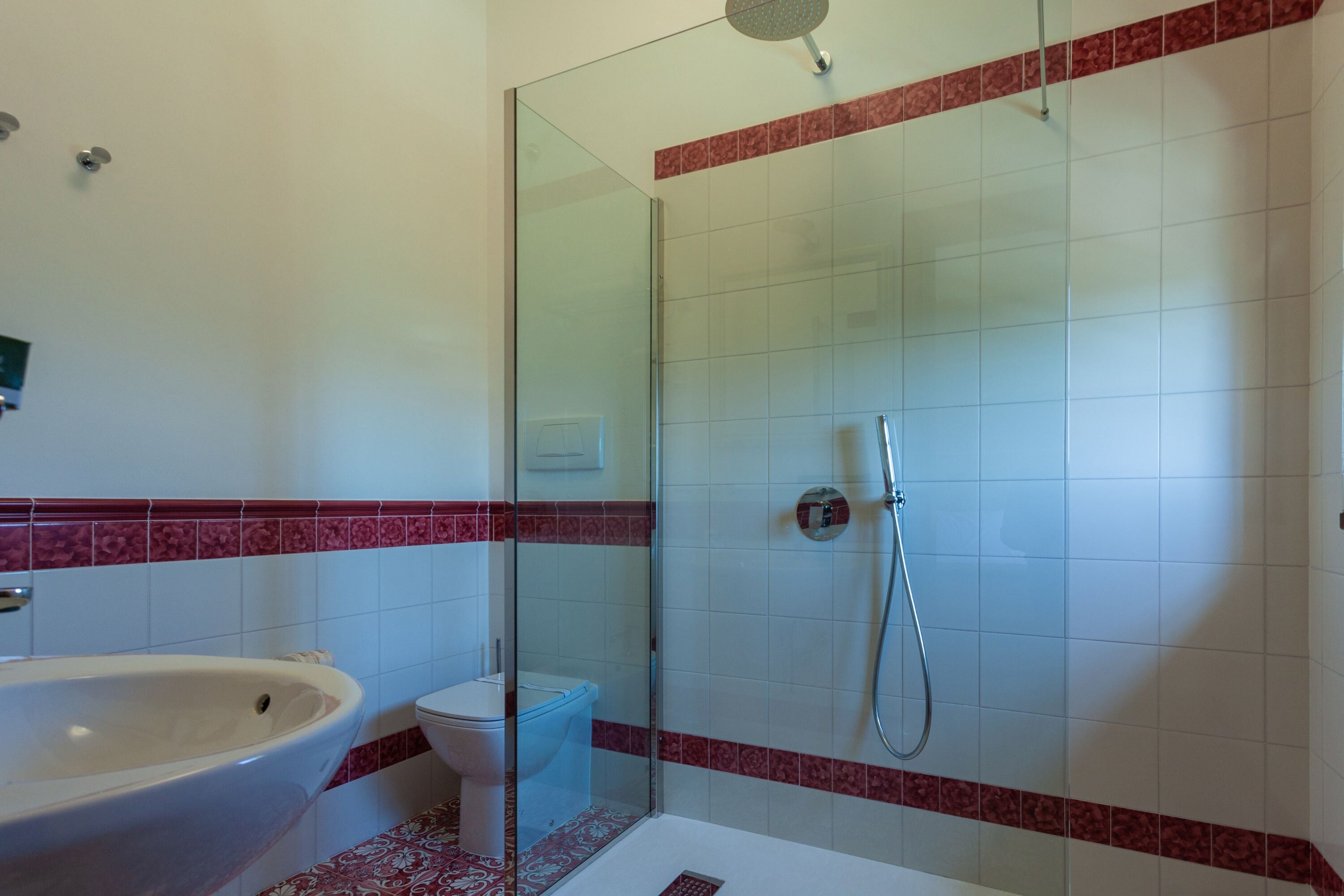 family room | bathroom | shower, rainfall showerhead, free toiletries, hair dryer