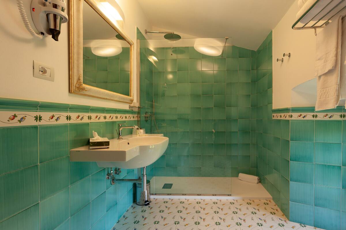 junior suite | bathroom | shower, rainfall showerhead, free toiletries, hair dryer
