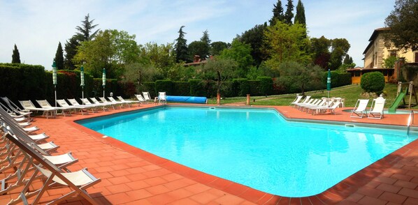 Seasonal outdoor pool, open 7 AM to 8:30 PM, pool umbrellas