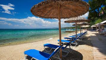 Private beach, white sand, sun-loungers, beach umbrellas