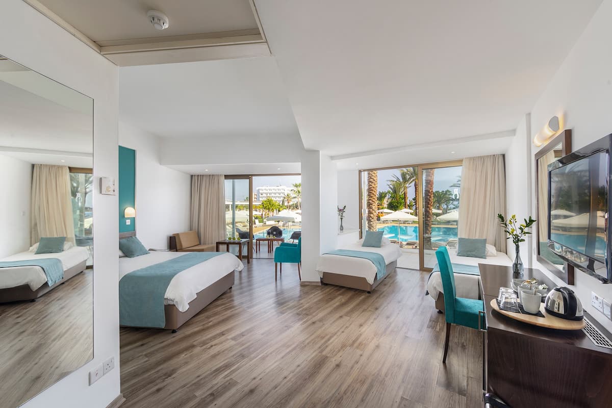 family room, pool view (superior) | 1 bedroom, minibar, in-room safe, desk