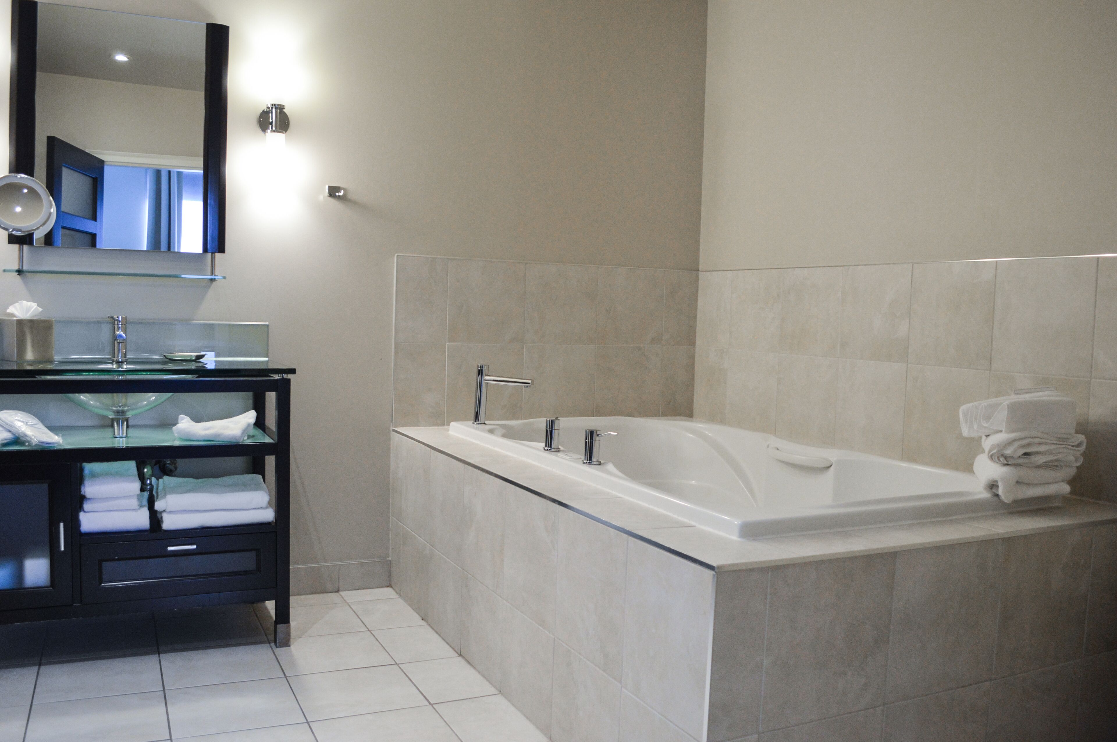 two queen beds with pullout and jetted tub | bathroom | designer toiletries, hair dryer, bathrobes, towels