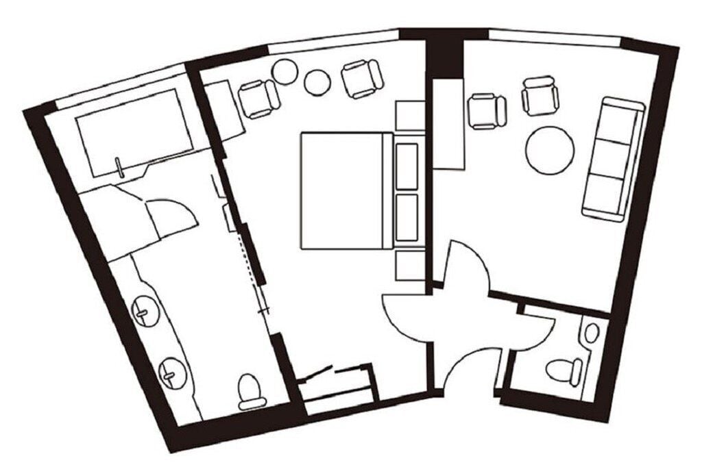 A floor plan of a hotel with a central living area, a kitchen, and multiple bedrooms.