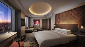 A modern hotel room with a large bed, a desk, and a seating area. There is a city view through the window, and the room has a unique ceiling design. - Sapporo Prince Hotel (Sapporo)