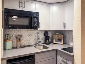 Fridge, microwave, stovetop, coffee/tea maker