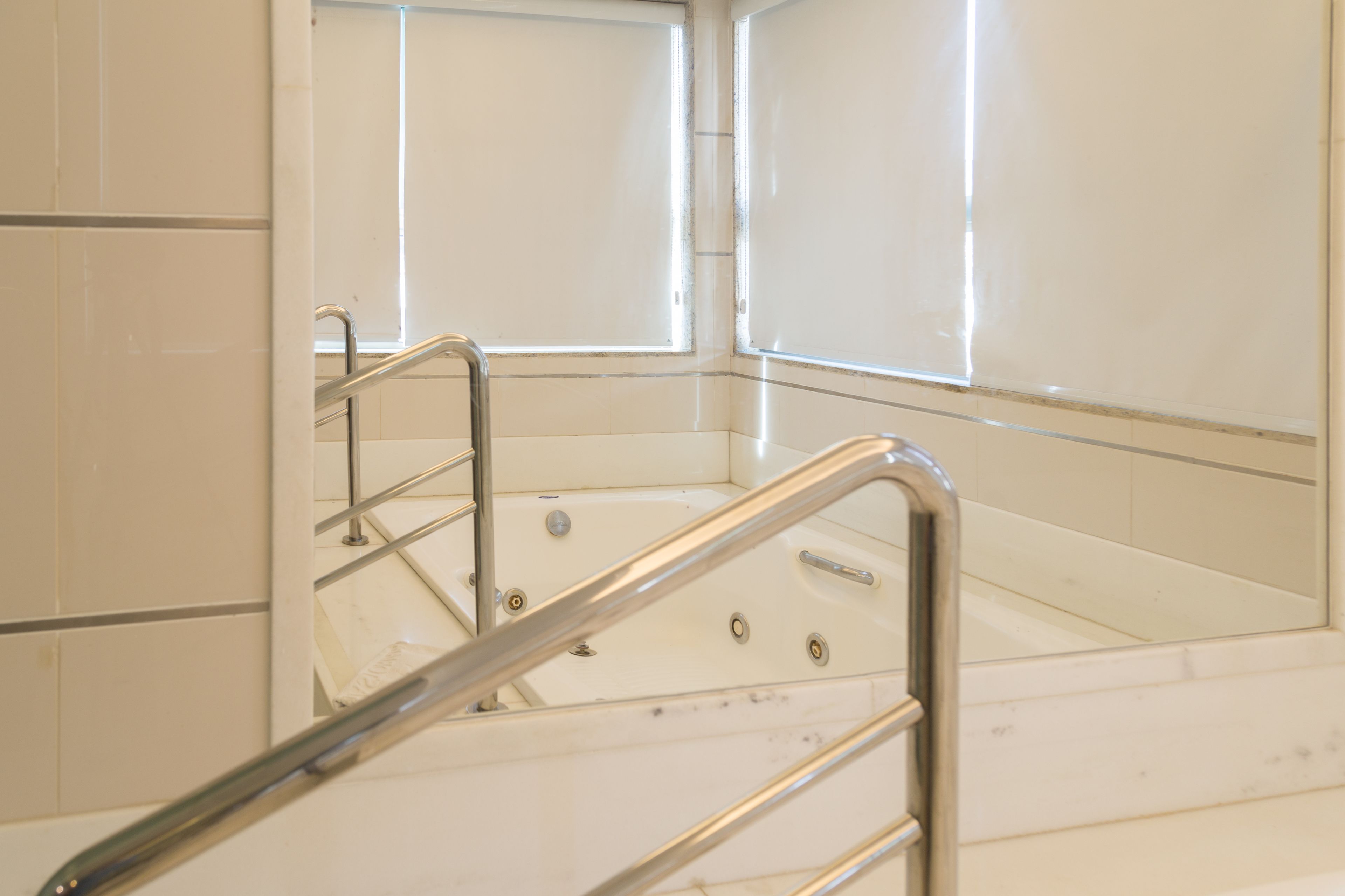 A bathroom with a bathtub, a shower, and a toilet.