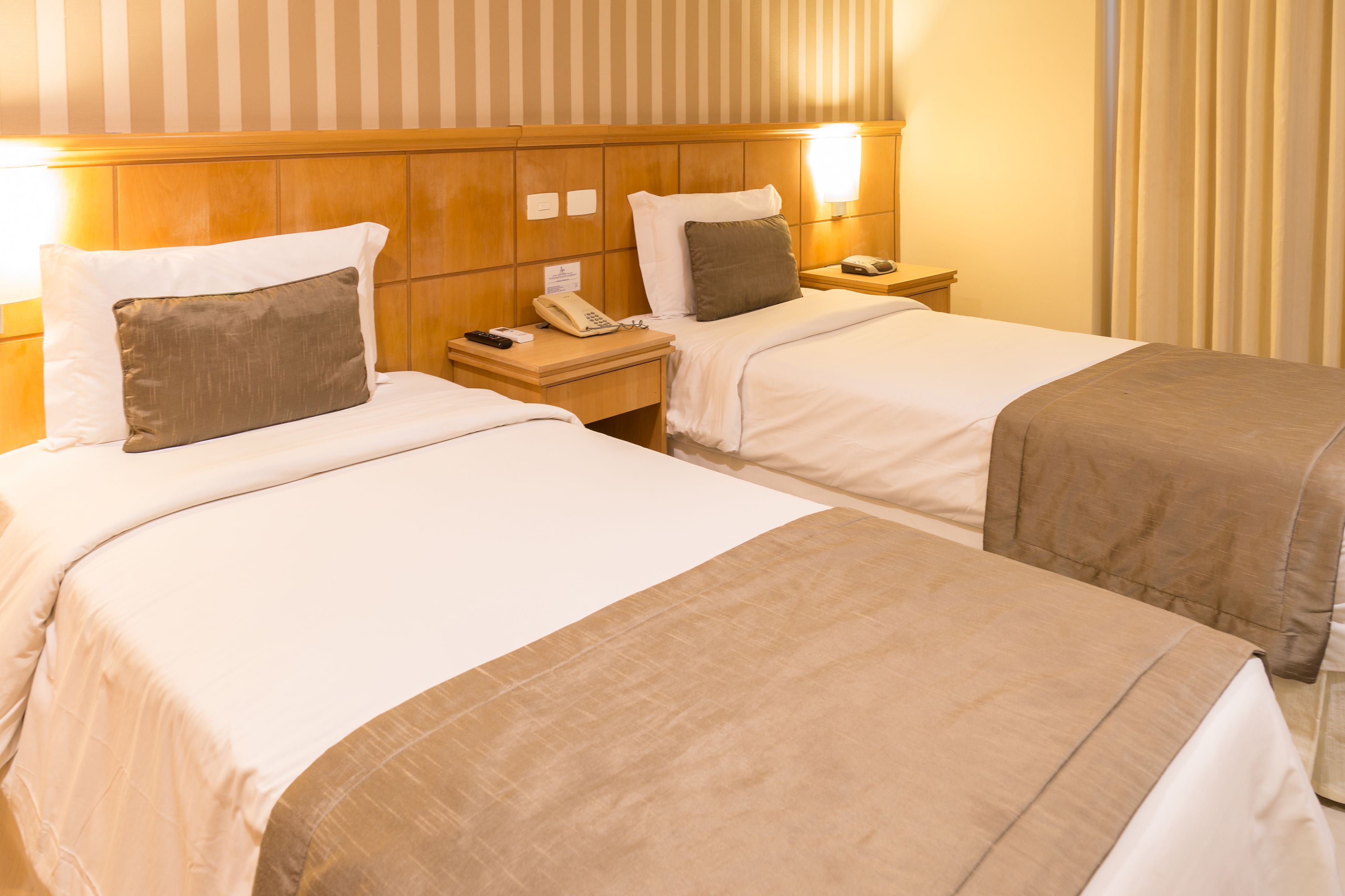 Standard Twin Room | Minibar, in-room safe, desk, blackout drapes