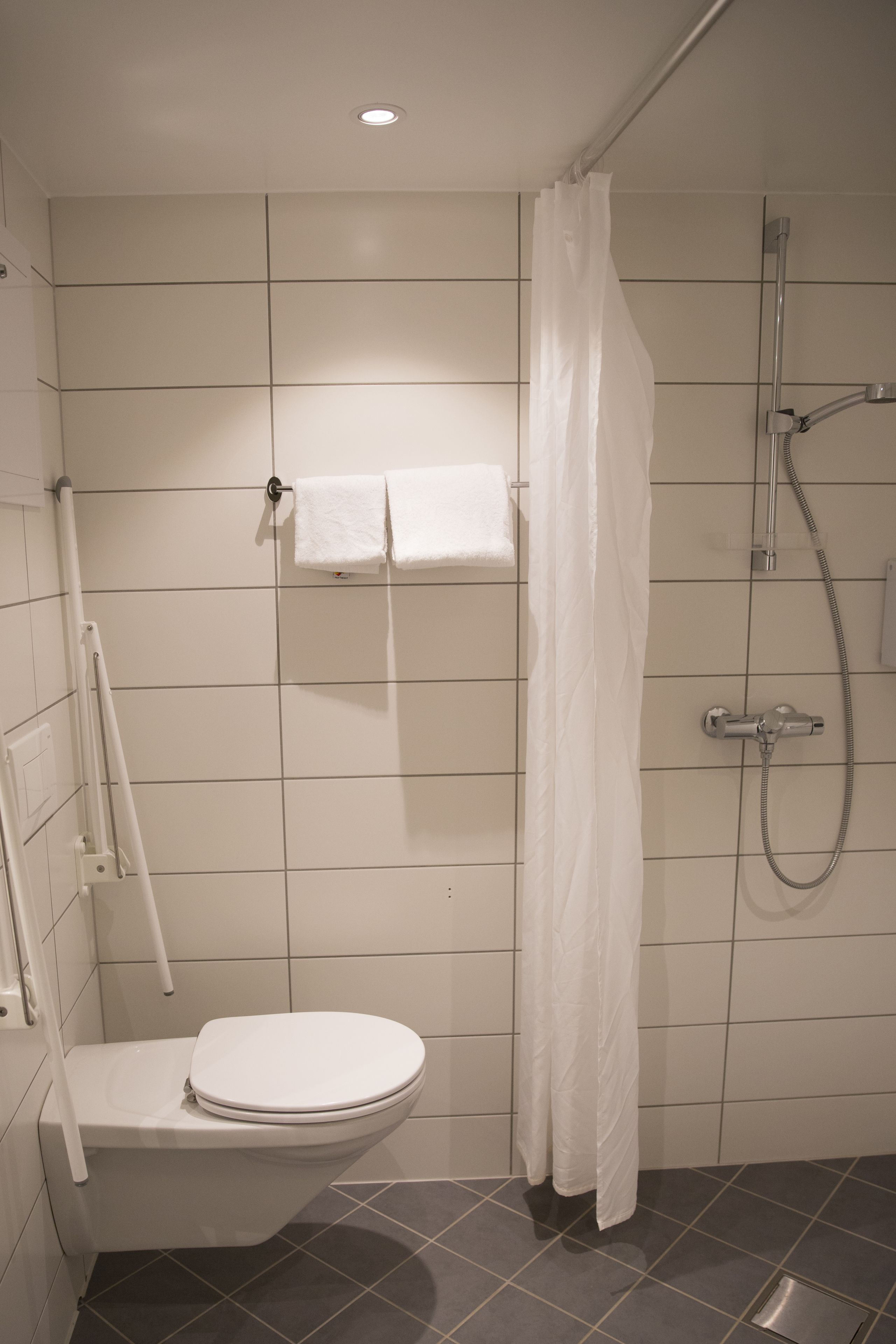 single room | bathroom | hair dryer, towels, toilet paper
