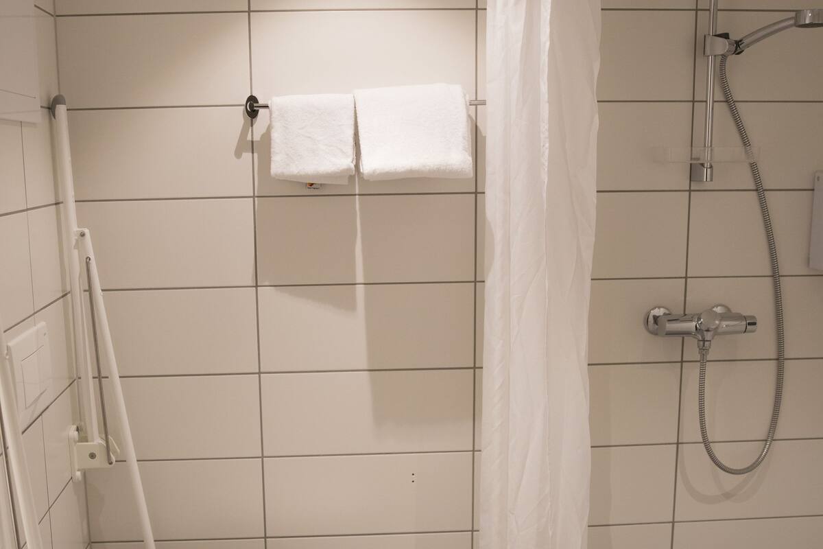 single room | bathroom | hair dryer, towels, toilet paper