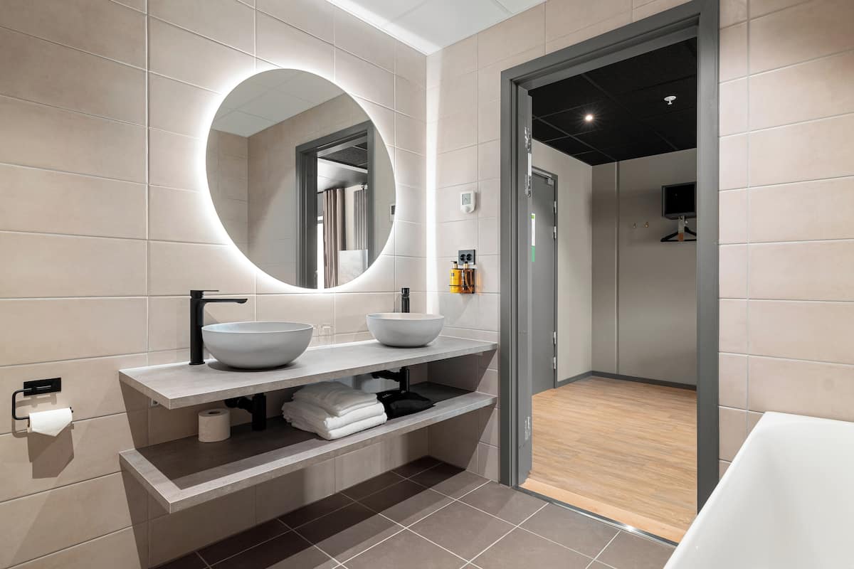 signature suite (haalandsuiten) | bathroom | hair dryer, heated floors, towels, soap