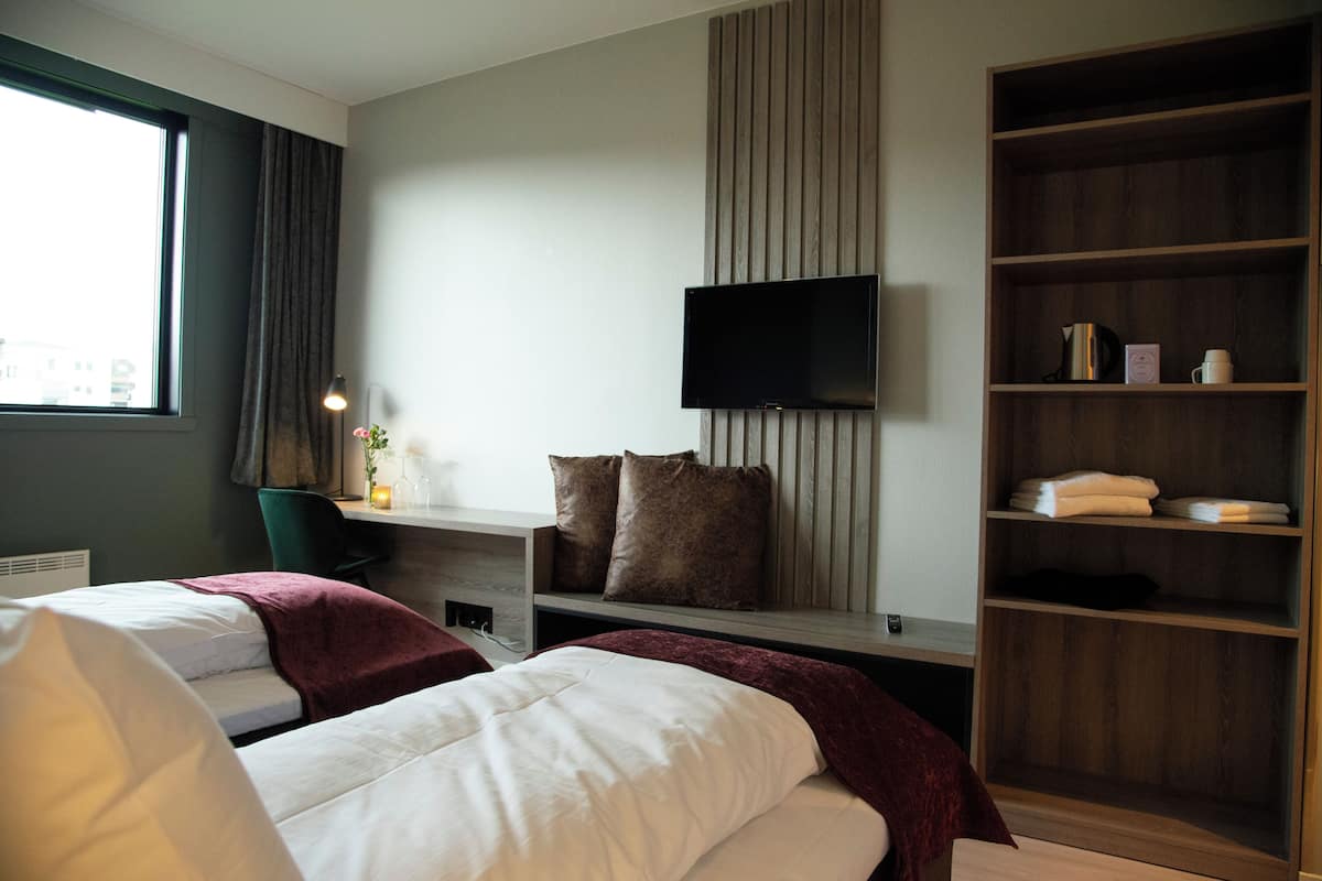 Premium bedding, pillow-top beds, desk, laptop workspace