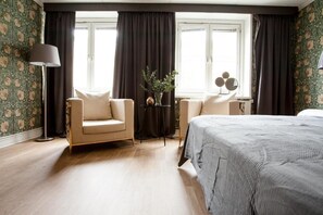 Quadruple Room | Living area | Flat-screen TV, offices - Centric Hotel (Norrköping)