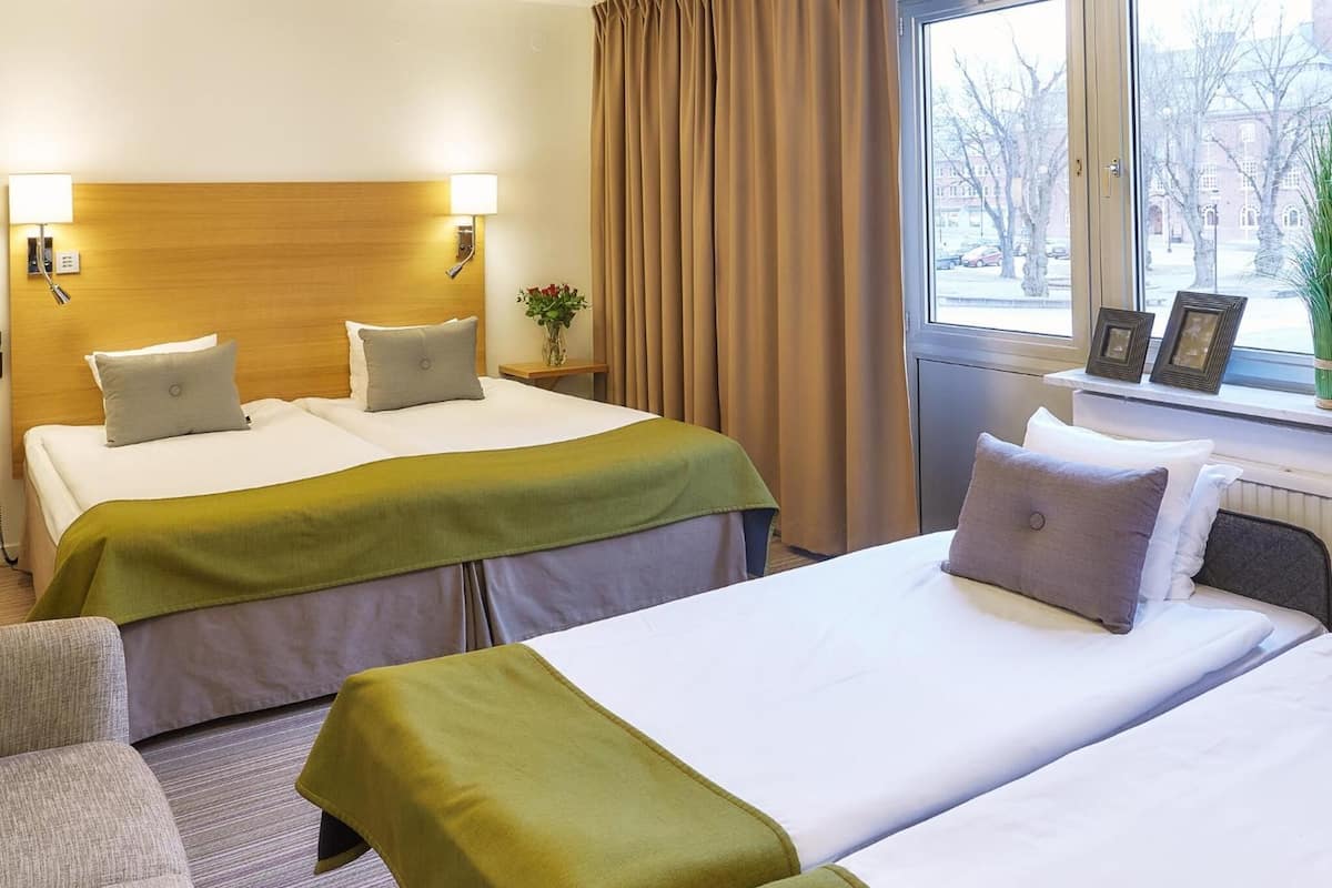 family room | 1 bedroom, desk, blackout curtains, iron/ironing board