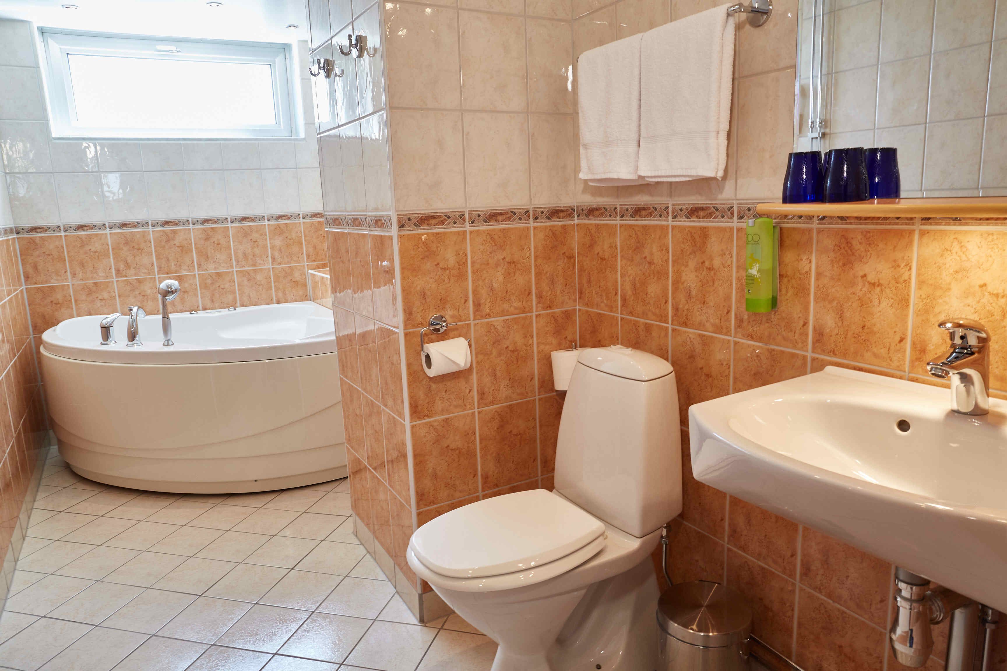 suite | bathroom | shower, hair dryer, towels