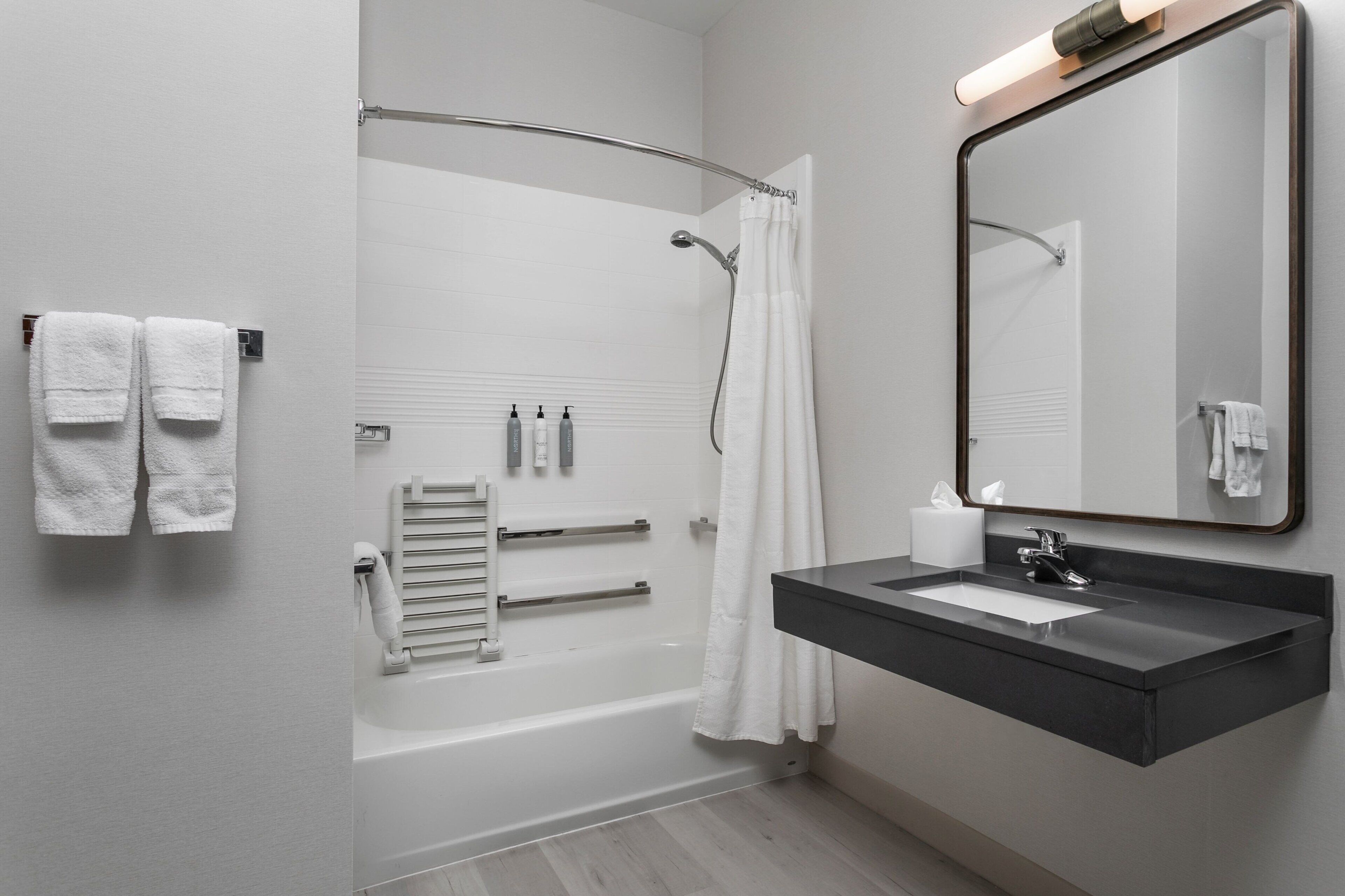 combined shower/bathtub, hair dryer, towels, soap