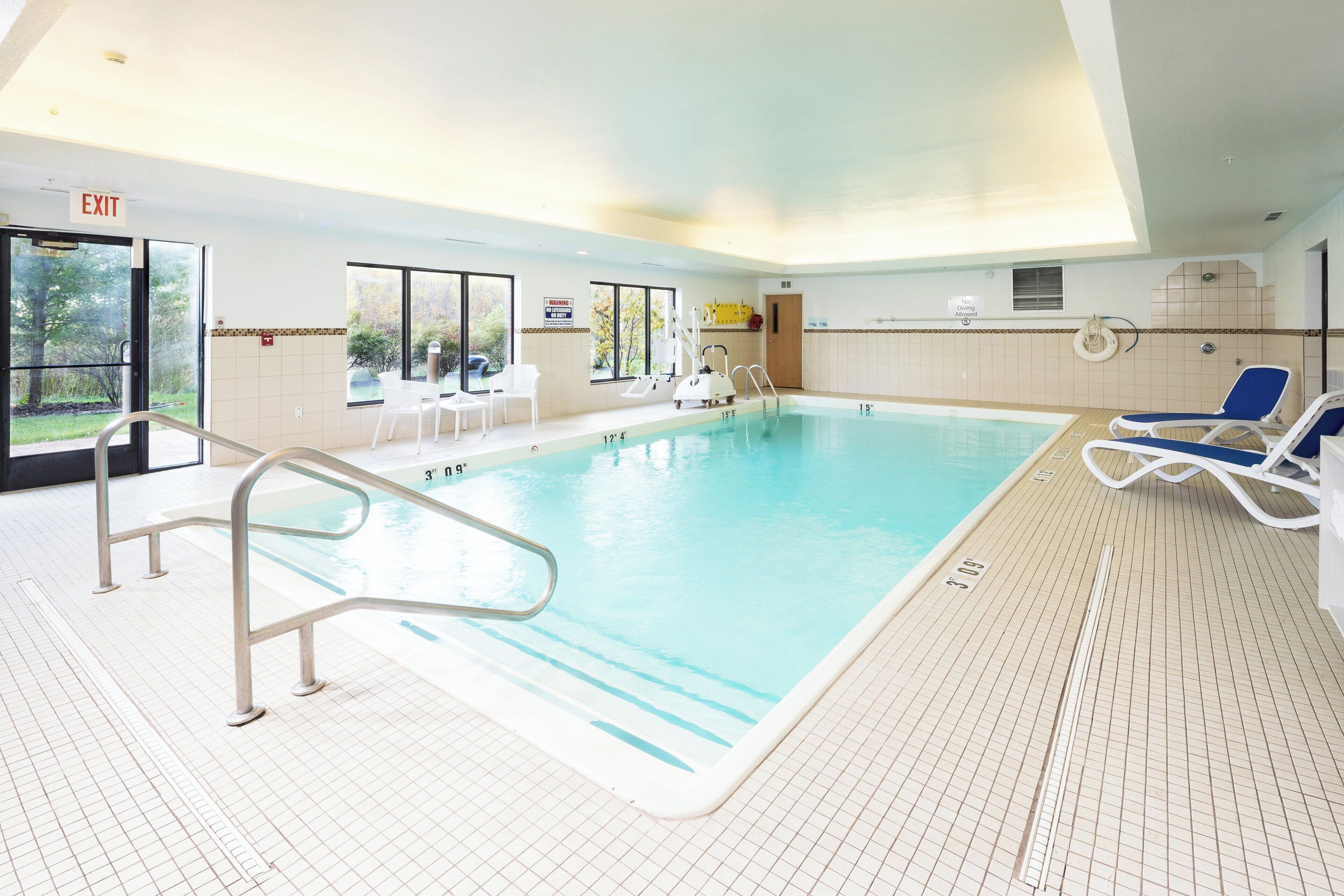Indoor pool, open 7 AM to 11 PM, pool loungers