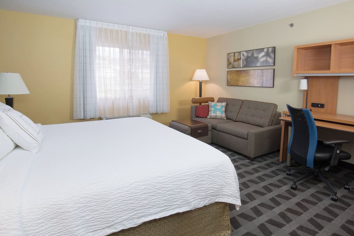 Premium bedding, desk, laptop workspace, iron/ironing board