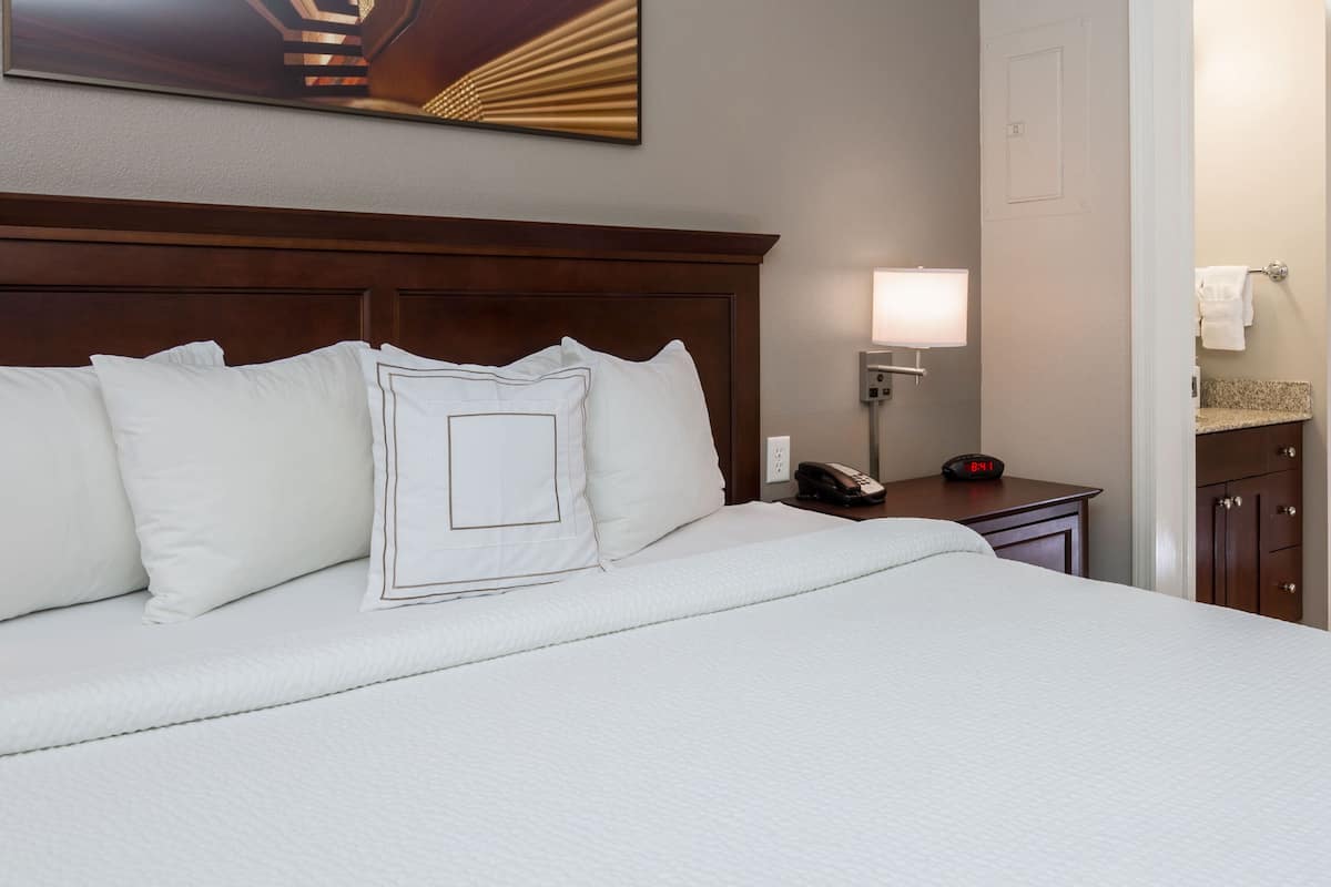 premium bedding, desk, laptop workspace, iron/ironing board