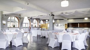 A banquet hall with round tables, white chairs, and a large chandelier. - Lord Haldon Country Hotel, Sure Hotel Collection by Best Western (Exeter)