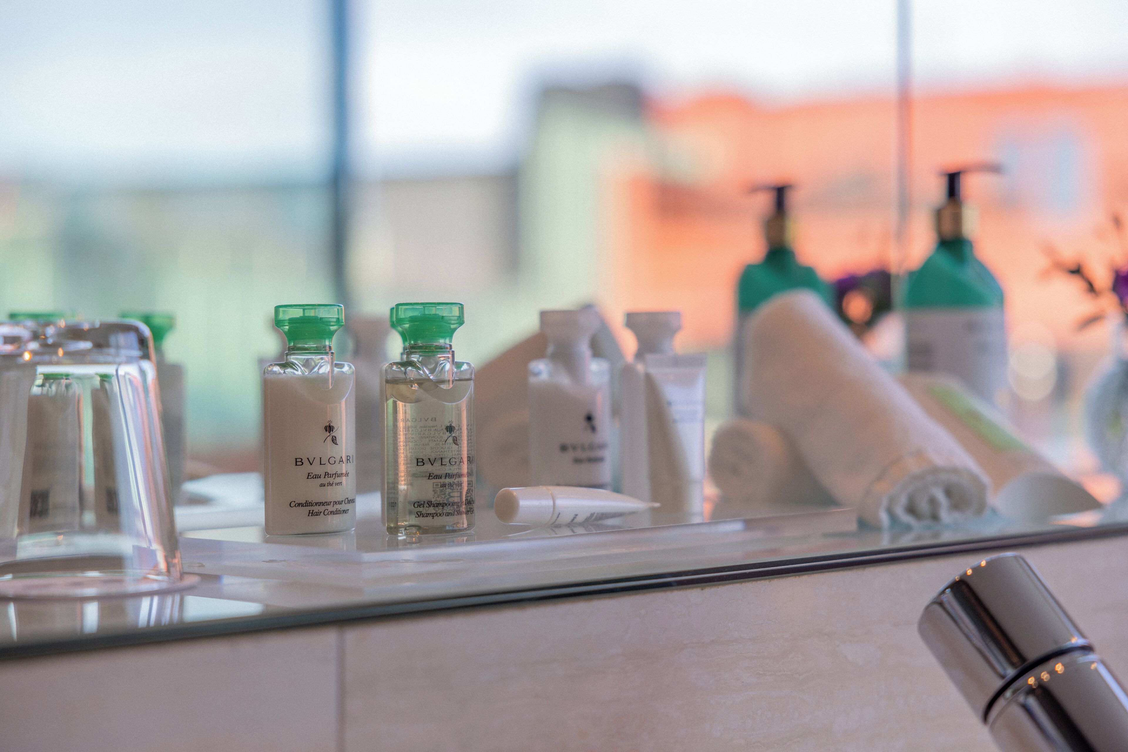 shower, designer toiletries, hair dryer, slippers