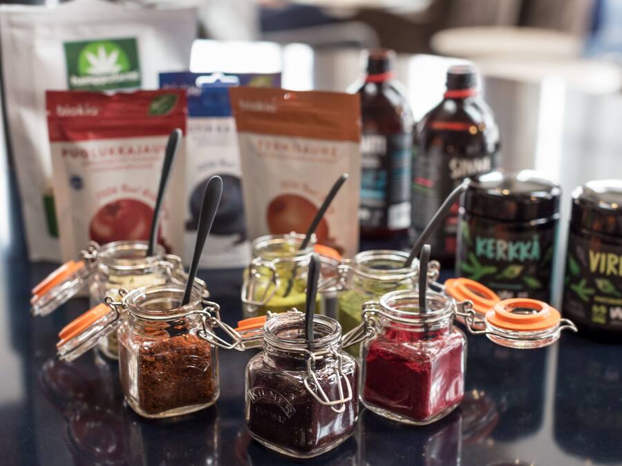 Various jars of condiments on a counter.