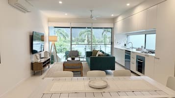 Executive Apartment, 2 Bedrooms, Pool View | Living area | 50-inch Smart TV with digital channels, Netflix, books