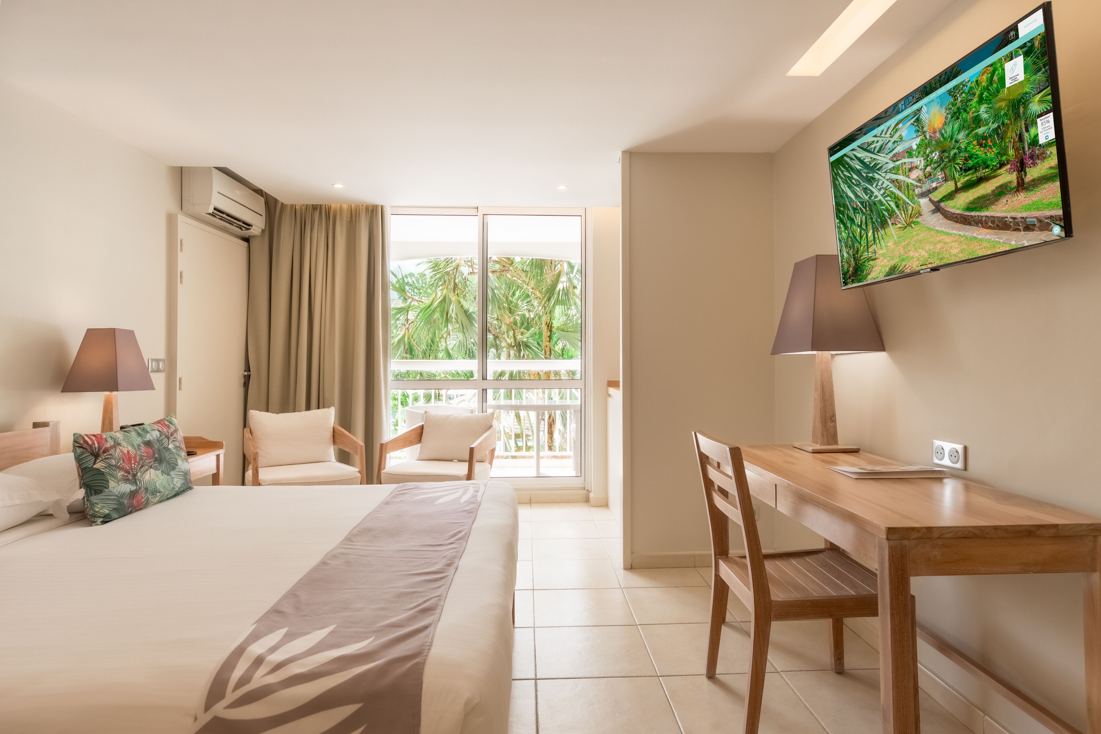 comfort room, garden view | premium bedding, in-room safe, laptop workspace, blackout curtains