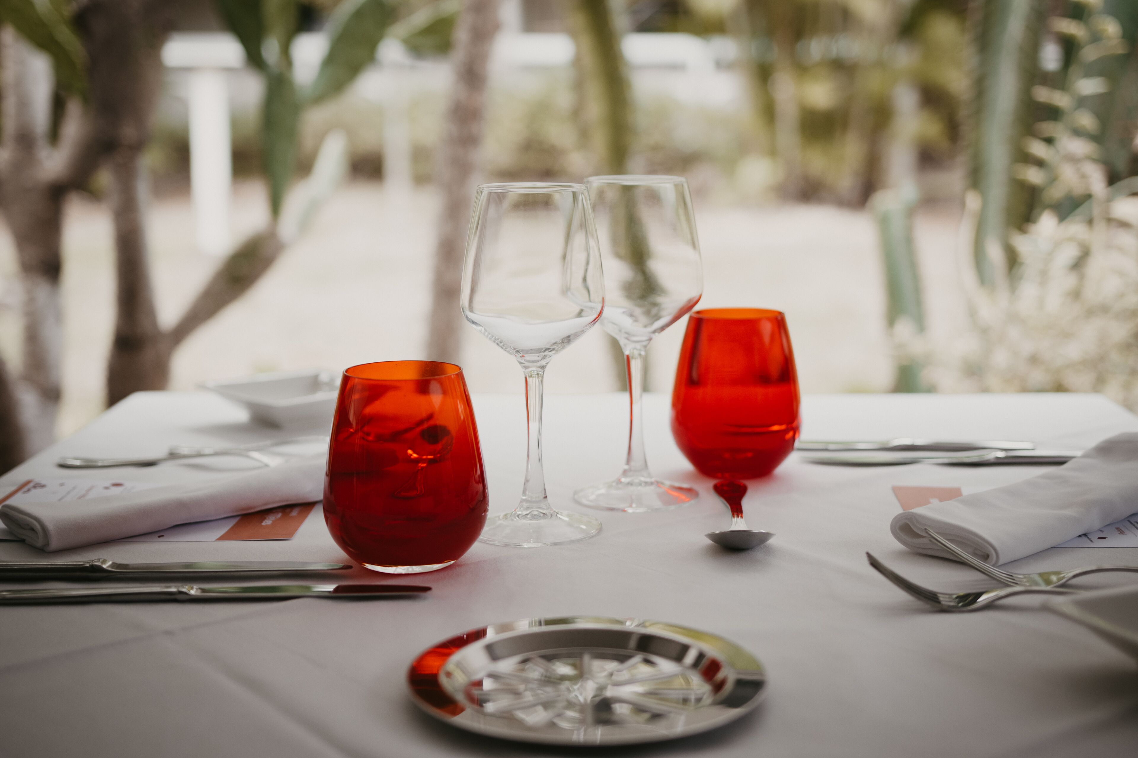 A table set for dining with wine glasses and a plate.