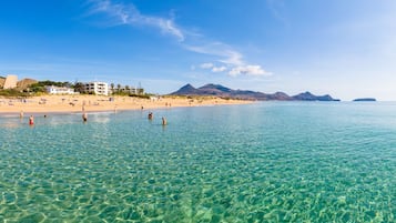 On the beach, white sand