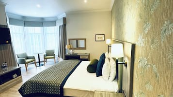 Deluxe Suite | Premium bedding, desk, laptop workspace, iron/ironing board
