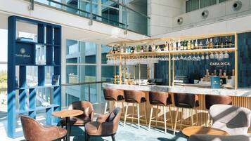 3 bars/lounges, poolside bar, beach bar