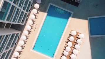Indoor pool, outdoor pool, pool umbrellas, pool loungers