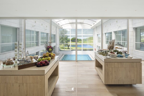 Breakfast, lunch, dinner served; Mediterranean cuisine, pool views 