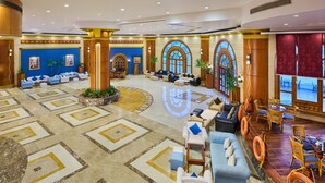 A spacious lobby with a central seating area, large windows, and a decorative floor pattern. - Dreams Vacation Sharm El Sheikh (Sharm El Sheikh)
