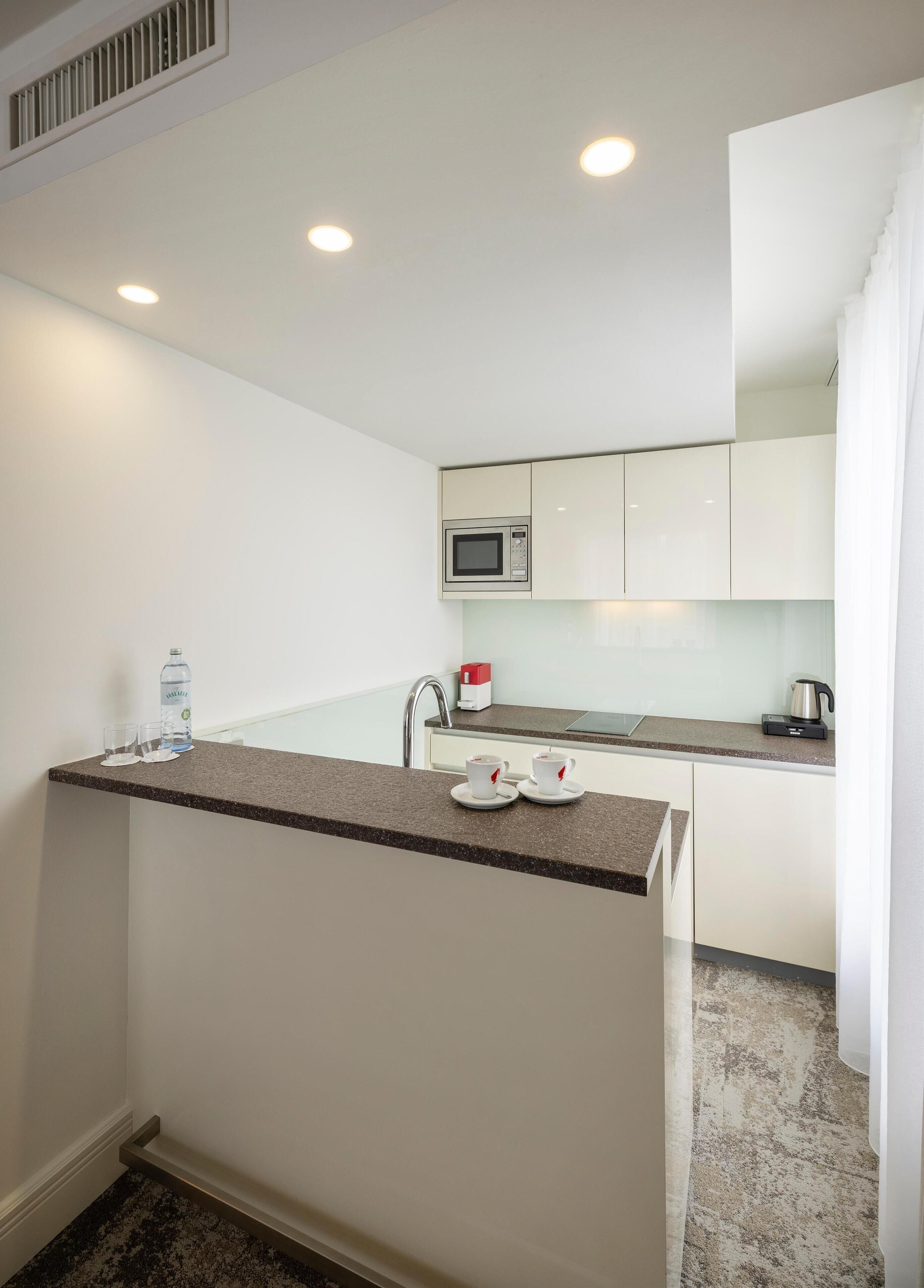 suite | in-room safe, desk, laptop workspace, blackout curtains